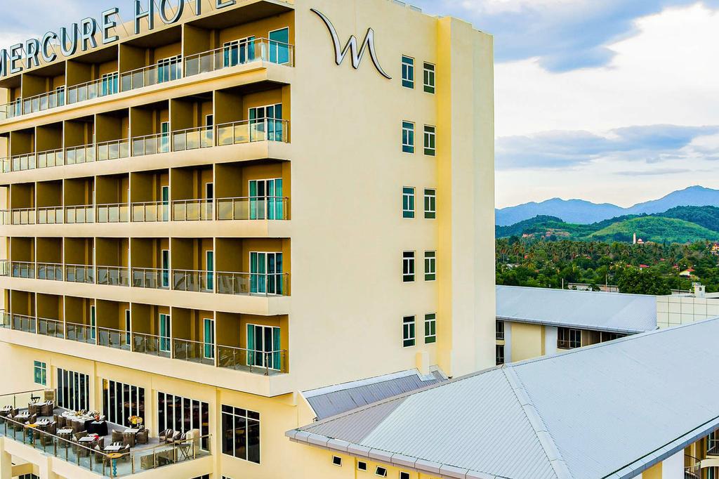 Mercure hotel in Langkawi with mountain views and balconies.