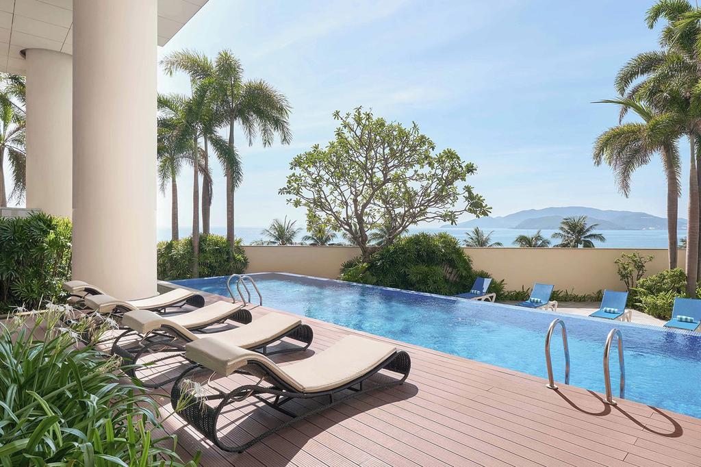 Luxurious pool deck with ocean view at Nha Trang Bay apartments.