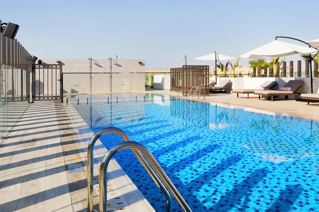 Rooftop infinity pool at a beachfront aparthotel on Palm Jumeirah.