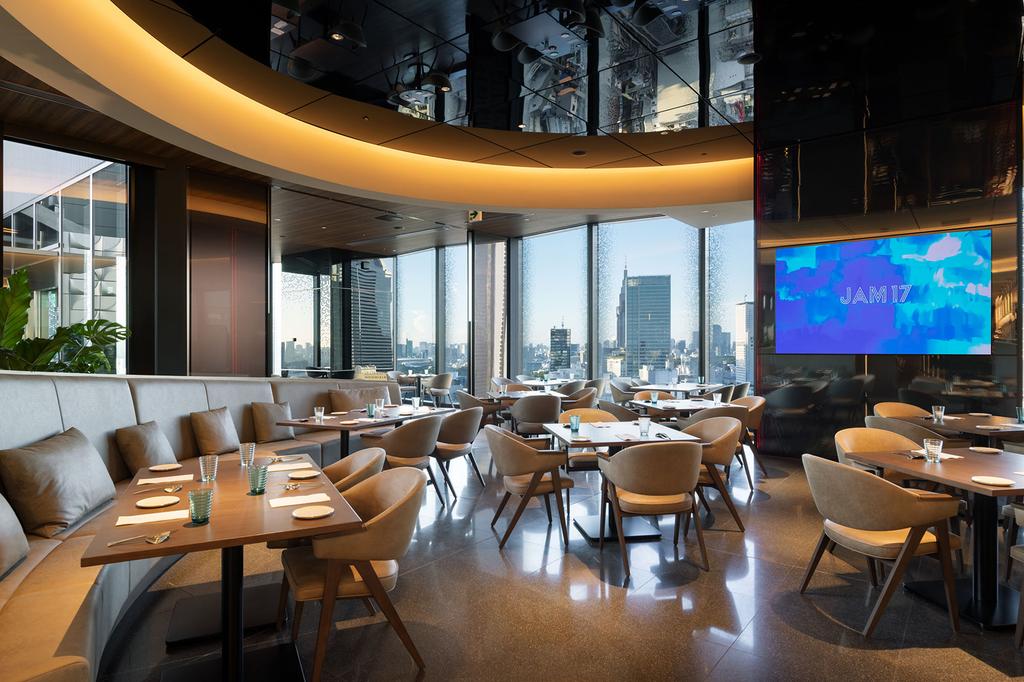 Modern dining area in Hotel Groove Shinjuku with city views.