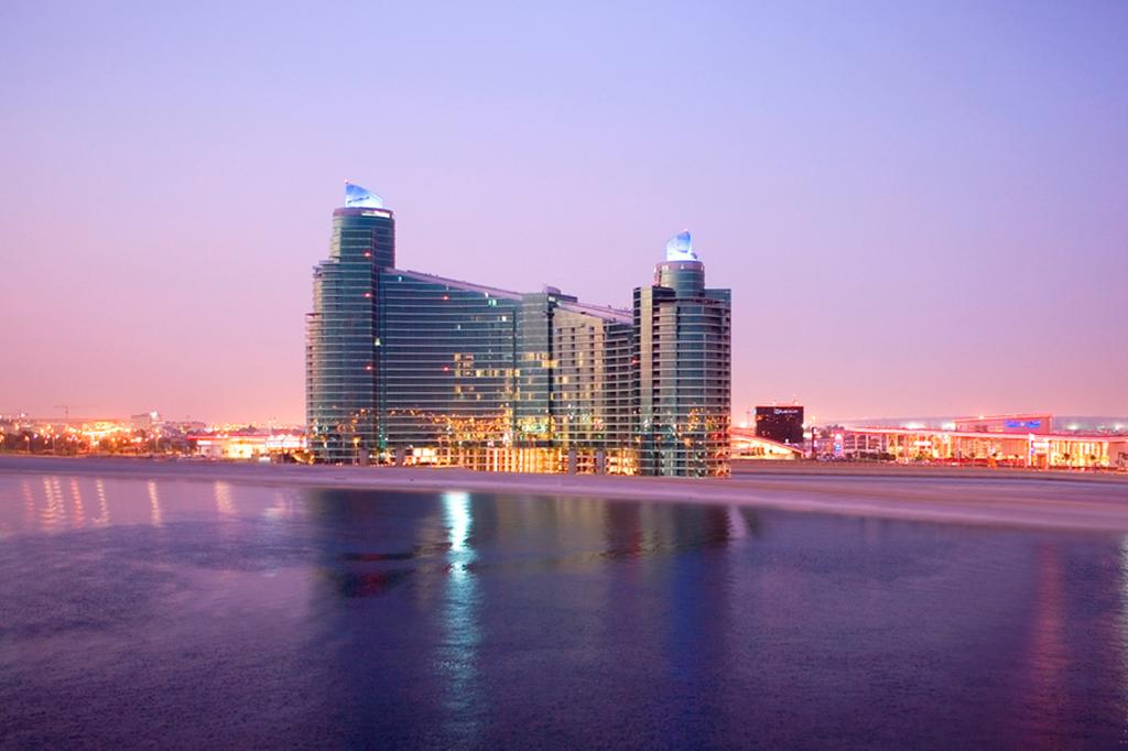 InterContinental Residence Suites with skyline views in Dubai at twilight.