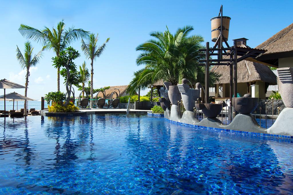 Luxury poolside view at Holiday Inn Resort Bali Benoa, Tanjung Benoa Beach.