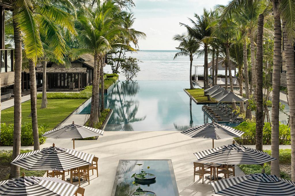 Olympic-size pool at a luxury seaside resort with ocean views.