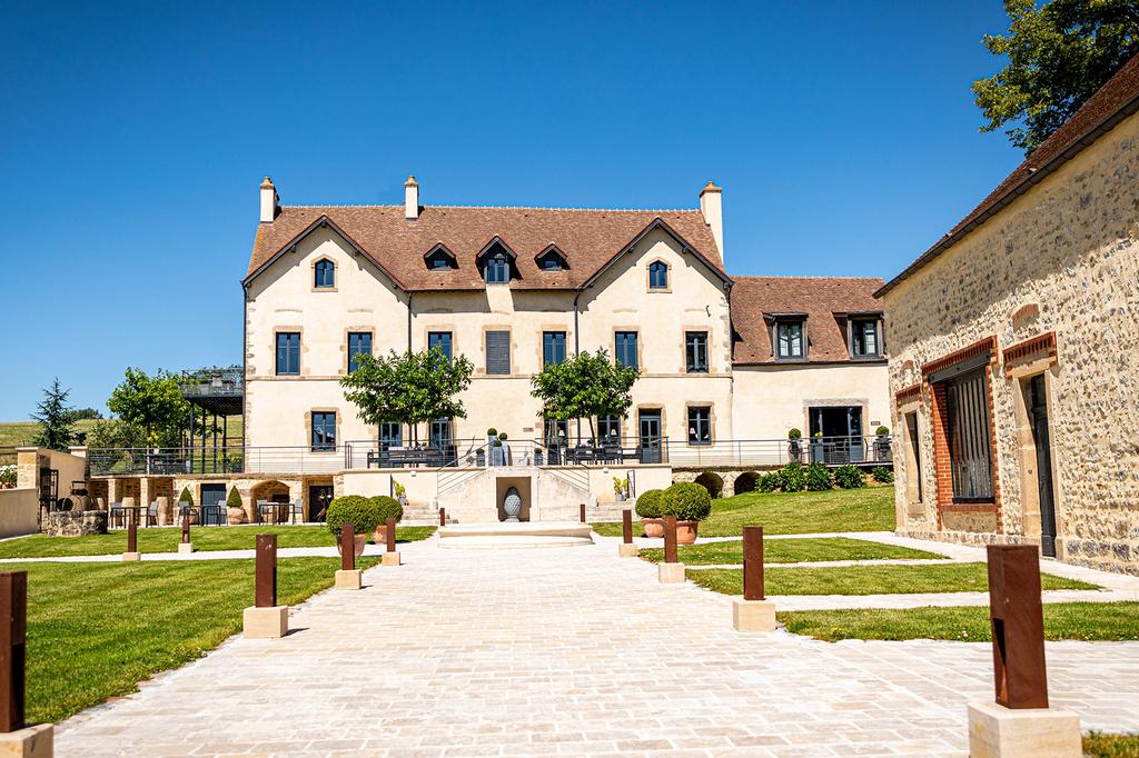 Charming Relais & Châteaux residence in Burgundy with pristine courtyard.
