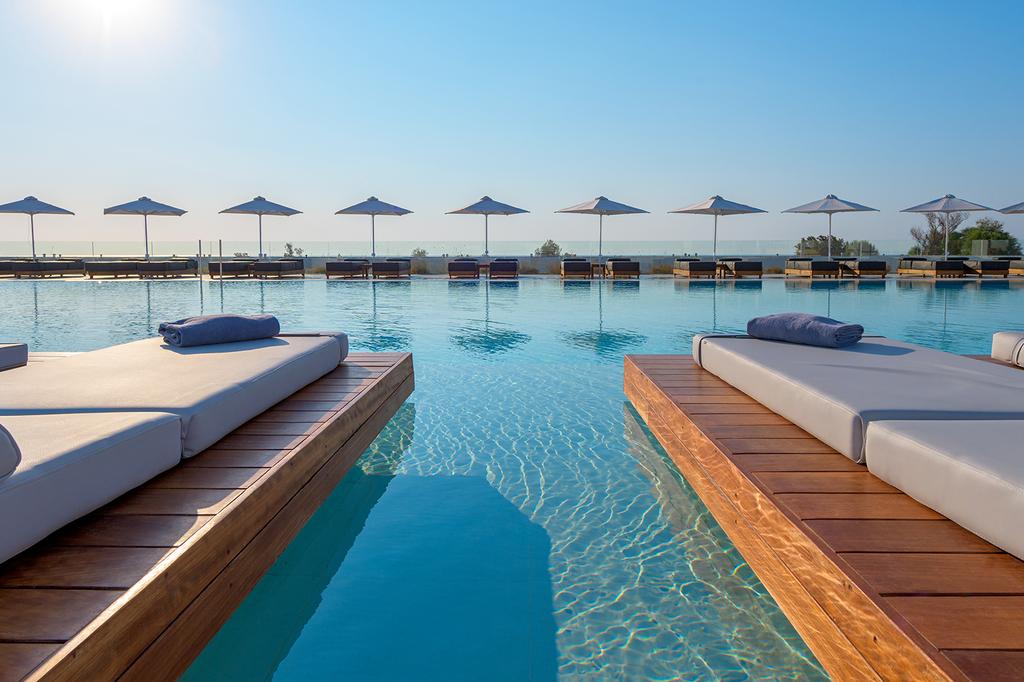 Luxurious poolside sunbeds at a Mediterranean resort in Rhodes.