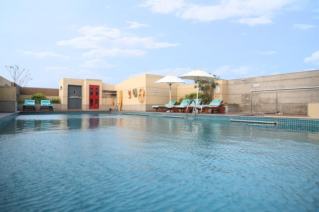 Outdoor pool at the Holiday Inn Chennai OMR IT Expressway hotel.