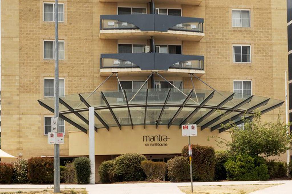 Facade of a modern hotel in Canberra's city centre.