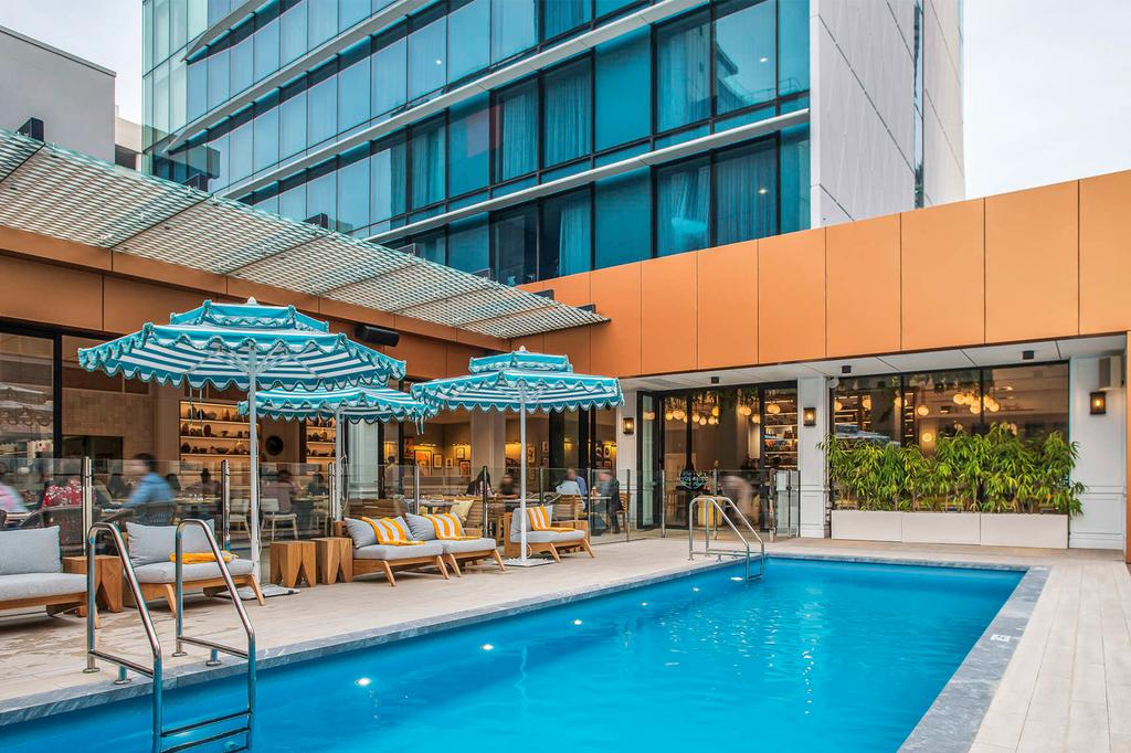 Outdoor pool at The Adnate with chic poolside bar in Perth CBD.