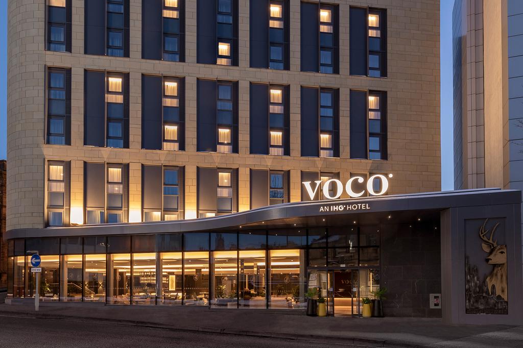Exterior of voco Edinburgh – Haymarket hotel at twilight.