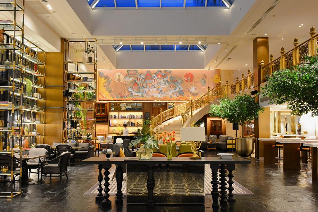 Luxurious hotel lobby with elegant decor and seating in Bangkok.