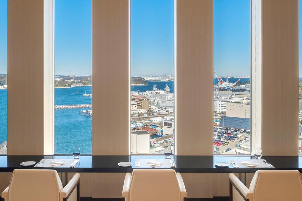 Dining area with panoramic view of Yokosuka Bay.