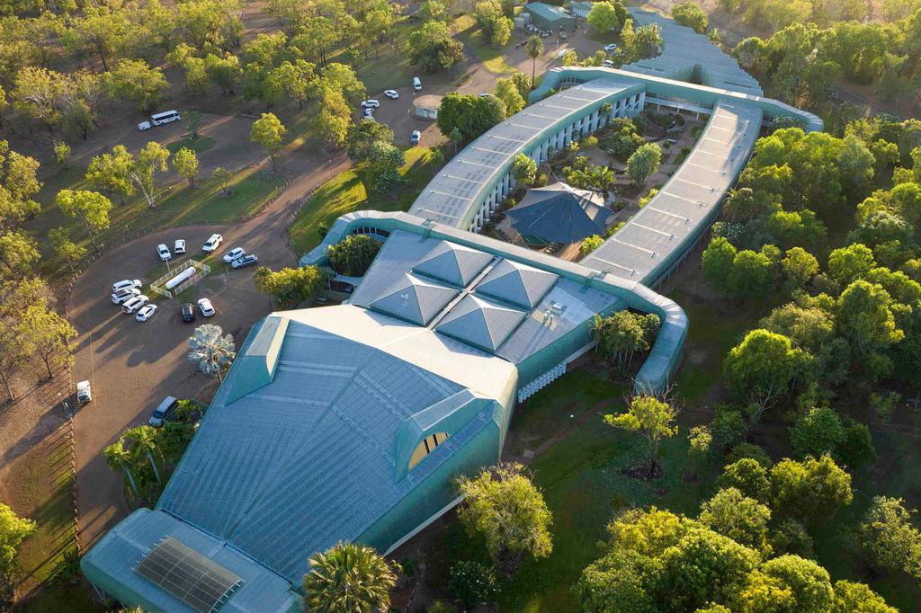 Aerial view of the crocodile-shaped Mercure Kakadu Crocodile Hotel in a lush setting.