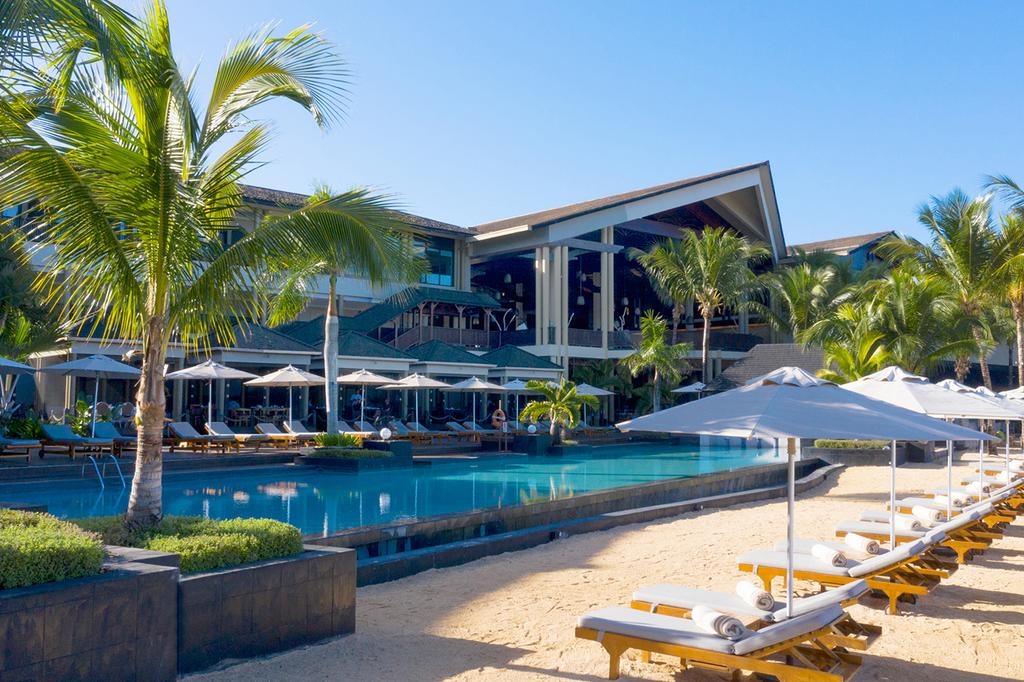 InterContinental Resort Mauritius with poolside bar and beach lounges.