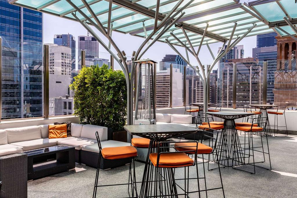 Chic rooftop bar with city views at Pullman Brisbane CBD.
