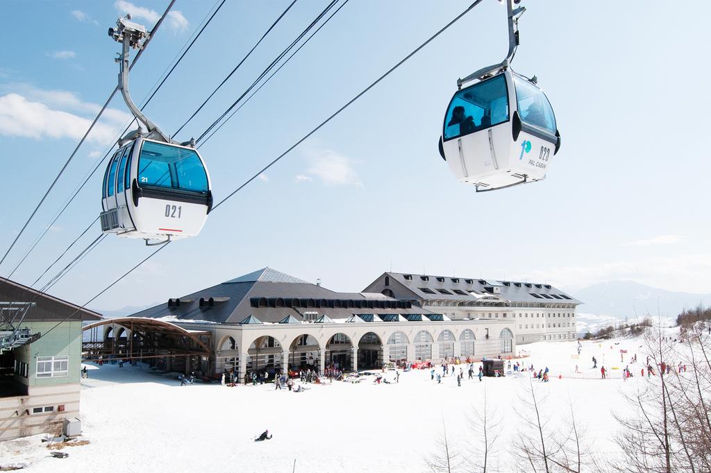 Ski resort with cable cars and snowy slopes in Japan.
