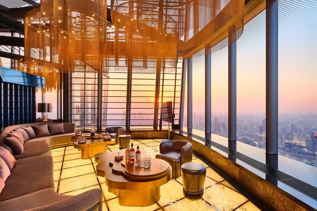 Luxurious lounge with city skyline views in Shanghai's tallest skyscraper.