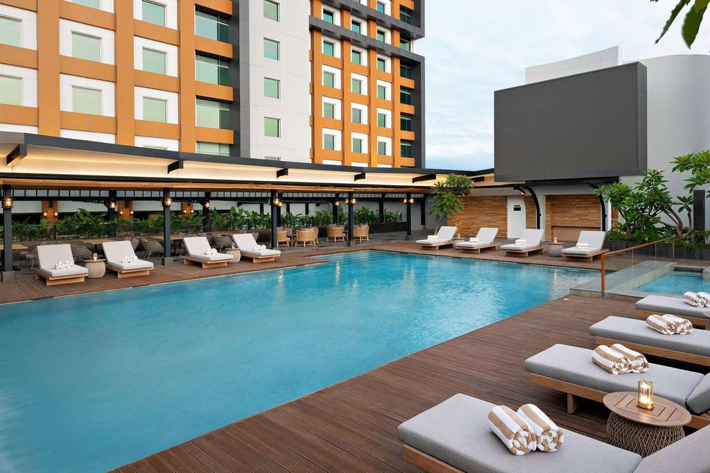 Luxurious pool area at Mövenpick Hotel in Central Jakarta.