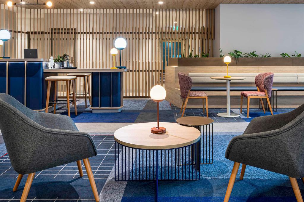 Modern lounge area at Novotel Melbourne Preston with stylish seating and decor.