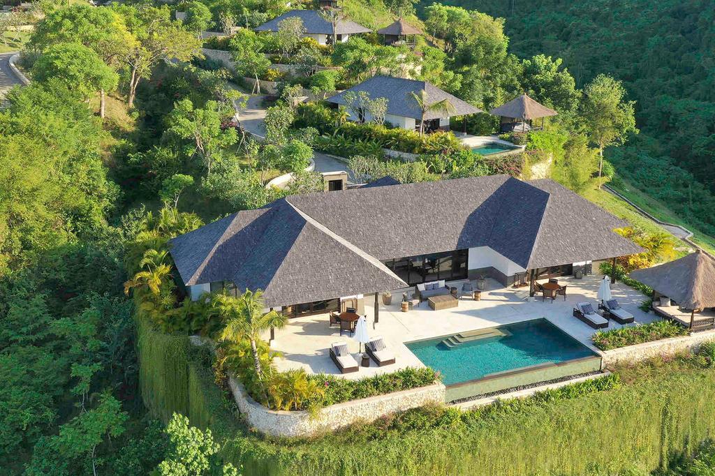 Luxury villa with private pool in lush Jimbaran gardens.