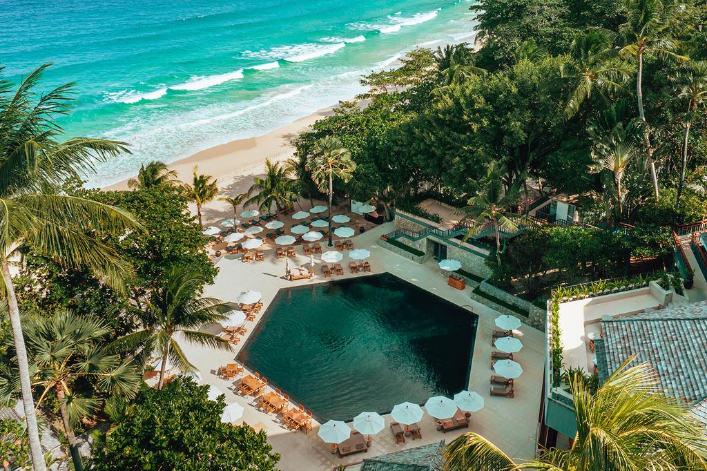 Aerial view of a luxury resort pool by Pansea Beach, Phuket.
