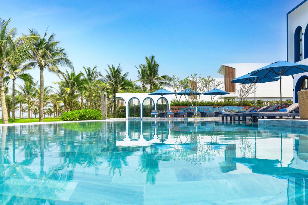 View of infinity pool at Wyndham Hoi An Royal Beachfront Resort. 