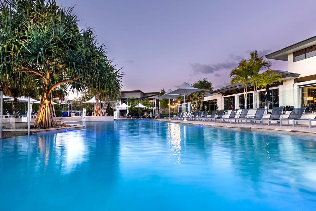 Sunset over lagoon pool at RACV Noosa Resort