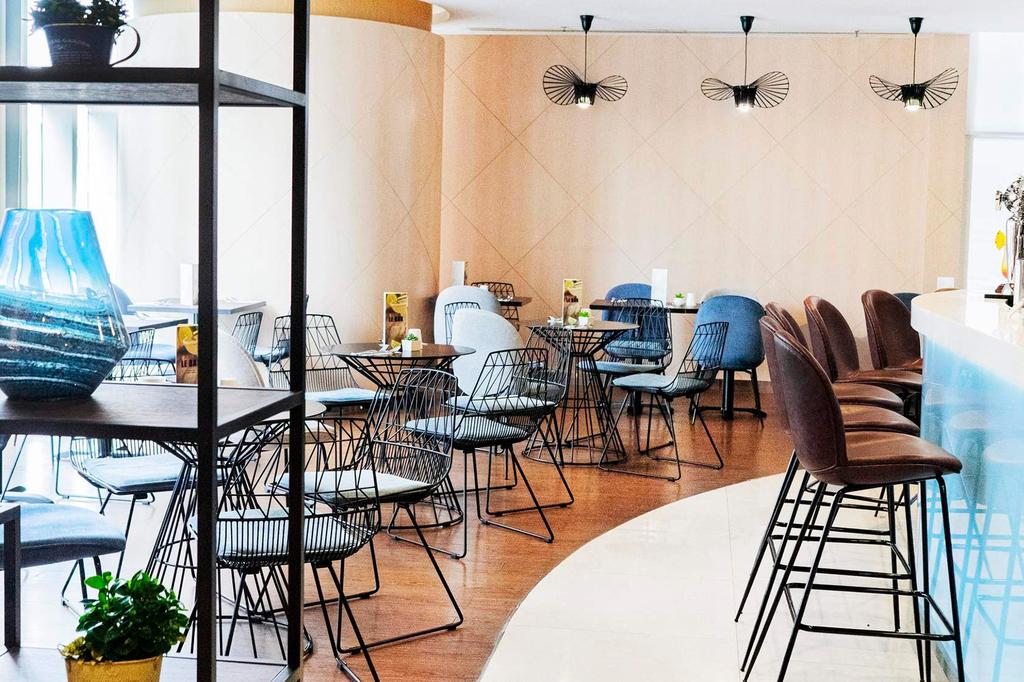 Modern bar and dining area in Hong Kong hotel.