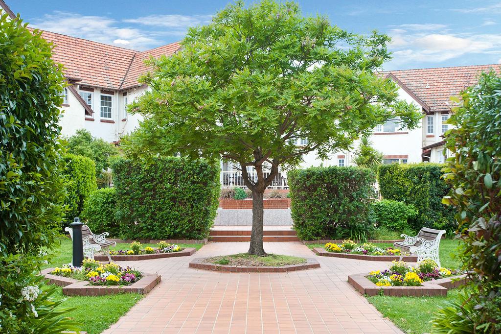 Charming garden courtyard at heritage-listed Mercure Canberra hotel.