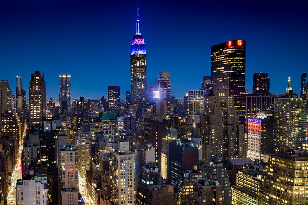 Night view of Midtown Manhattan with the Empire State Building.