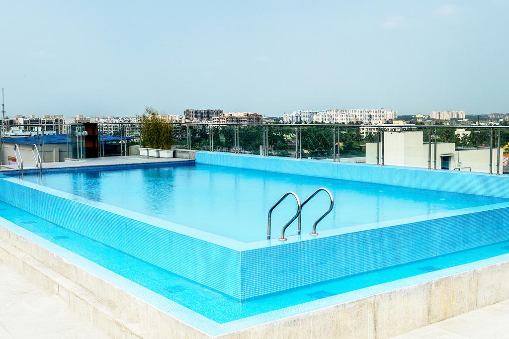 Rooftop outdoor swimming pool with city views in Kolkata.