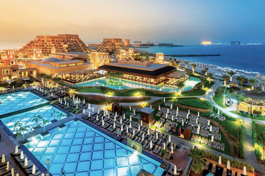 Five-star resort on Al Marjan Island with pools and ocean views.