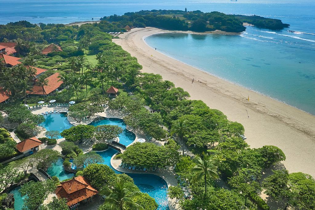 Aerial view of luxurious beachfront resort in Nusa Dua, Bali.