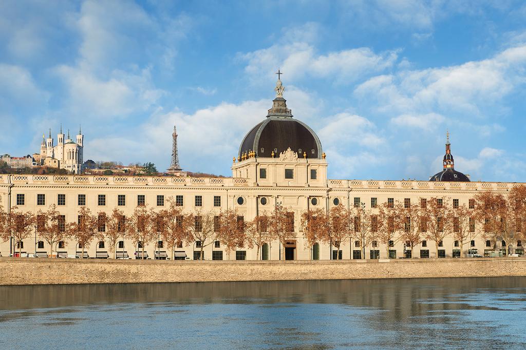InterContinental Lyon overlooking the Rhone River with historic architecture.