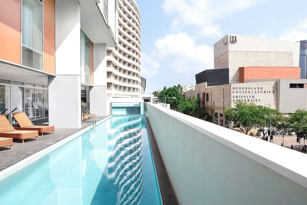 Heated lap pool at Brisbane Mantra hotel with city views.