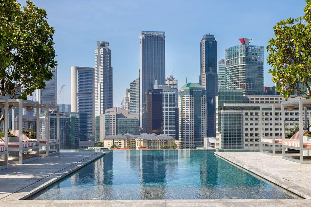 Infinity pool with city skyline at Mondrian Singapore.