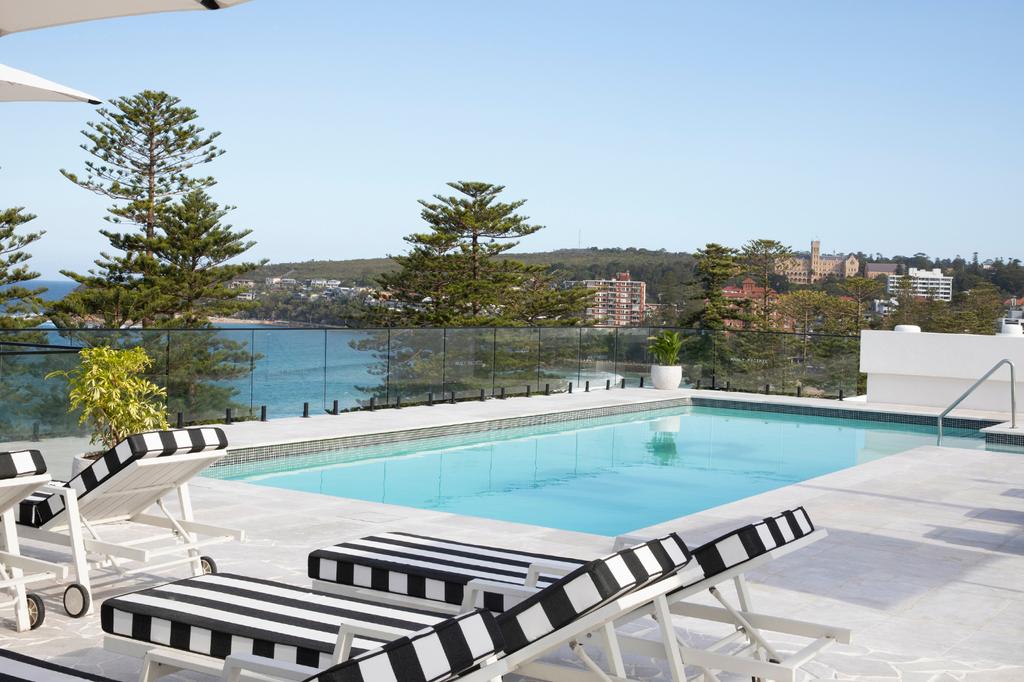 Rooftop pool with ocean view at Manly Pacific Hotel, Sydney.