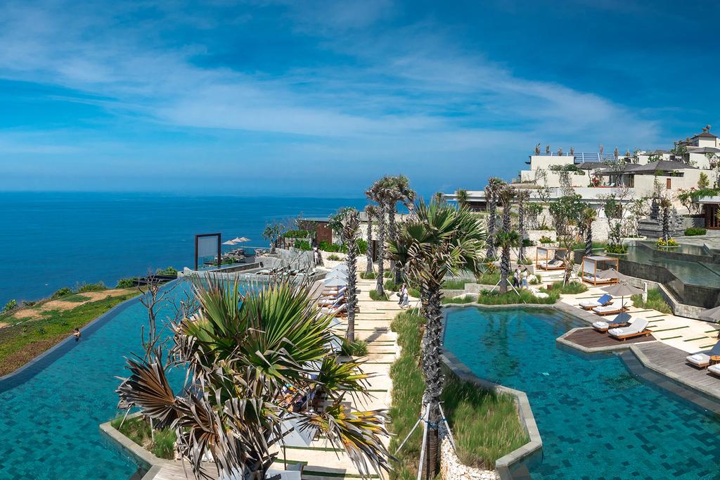 Luxurious cliffside pool villa in Bali with ocean views.