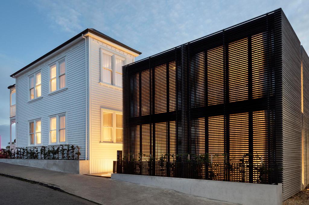Exterior of a boutique hotel in Ponsonby, Auckland at dusk.