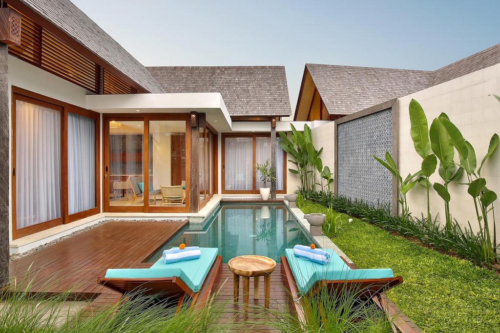 Luxurious private pool villa in Sanur, Bali, with tropical greenery.