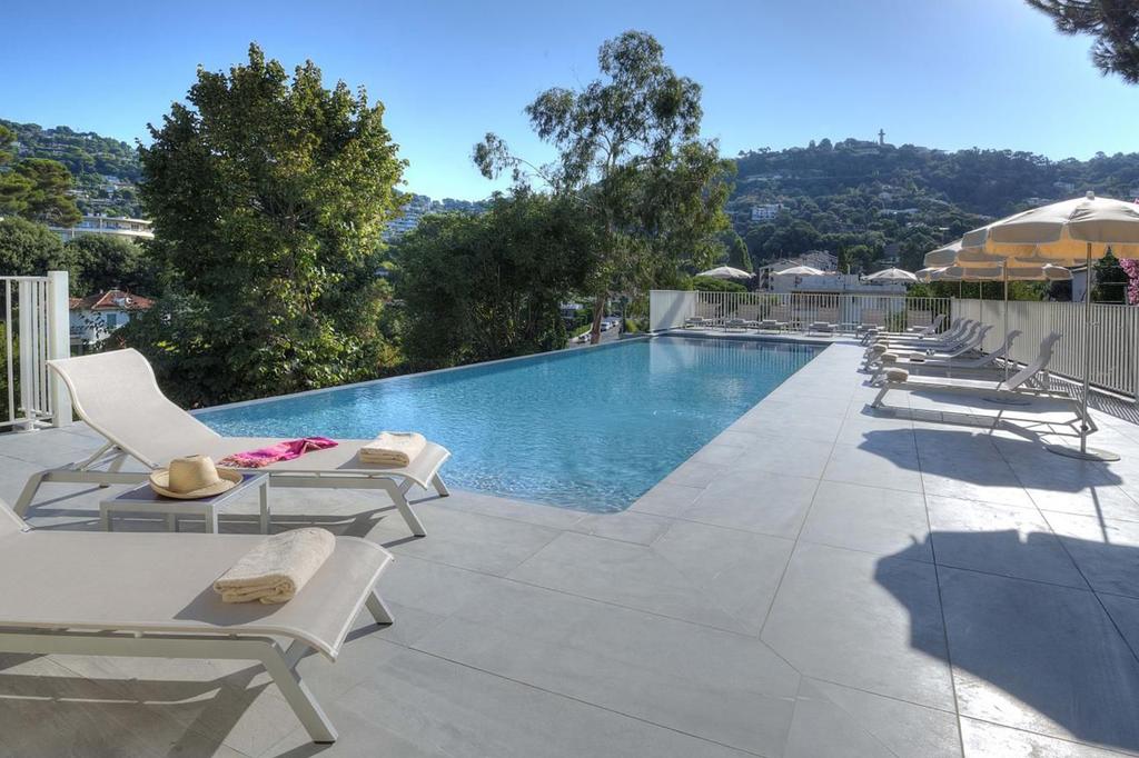 Elegant pool area at La Bastide de l’Oliveraie in Cannes.