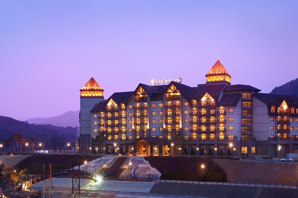 InterContinental Alpensia Pyeongchang Resort illuminated at dusk in South Korea.