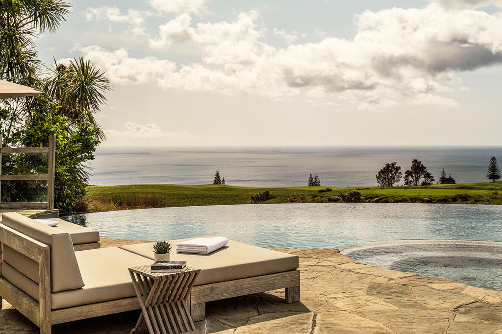 Infinity pool overlooking the ocean at Rosewood Kauri Cliffs luxury resort in Bay of Islands.