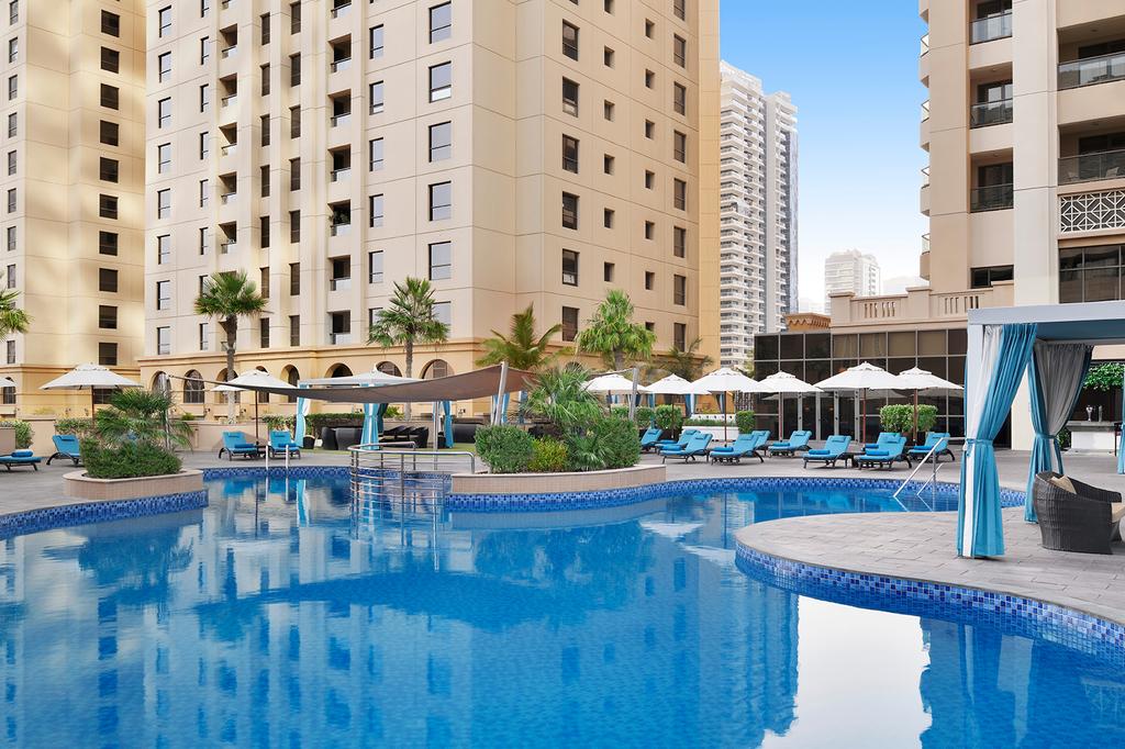 Luxury hotel pool area on Jumeirah Beach, Dubai.