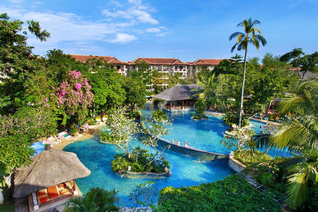 Aerial view of Novotel Bali Nusa Dua with lagoon pool and lush gardens. 