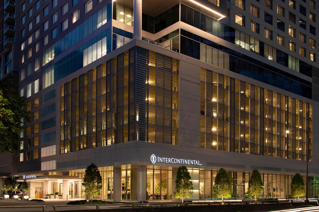 Elegant exterior of the InterContinental Houston Hotel at dusk.