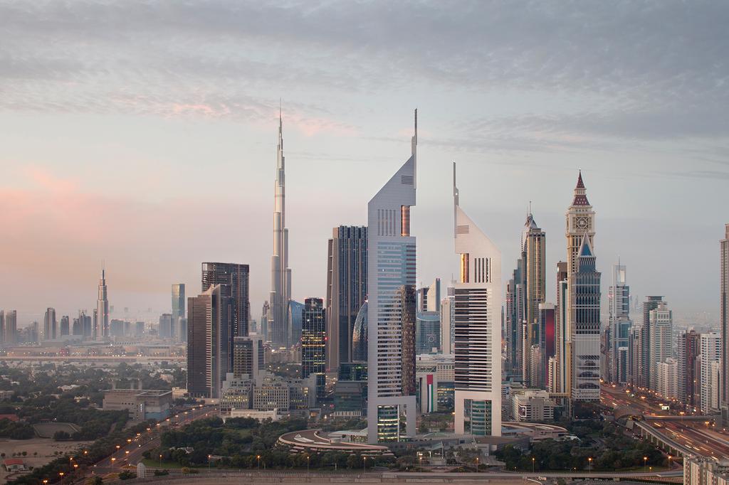 Skyline view of Jumeirah Emirates Towers near Burj Khalifa in Dubai.