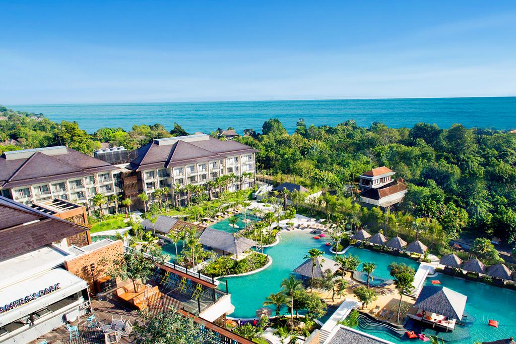 Aerial view of Mövenpick Resort & Spa Jimbaran Bali with pool and ocean.  