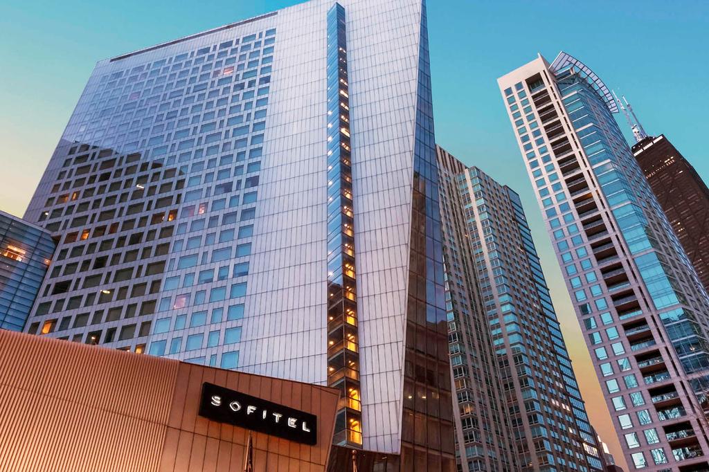 Luxury hotel tower on Chicago's Magnificent Mile at sunset.
