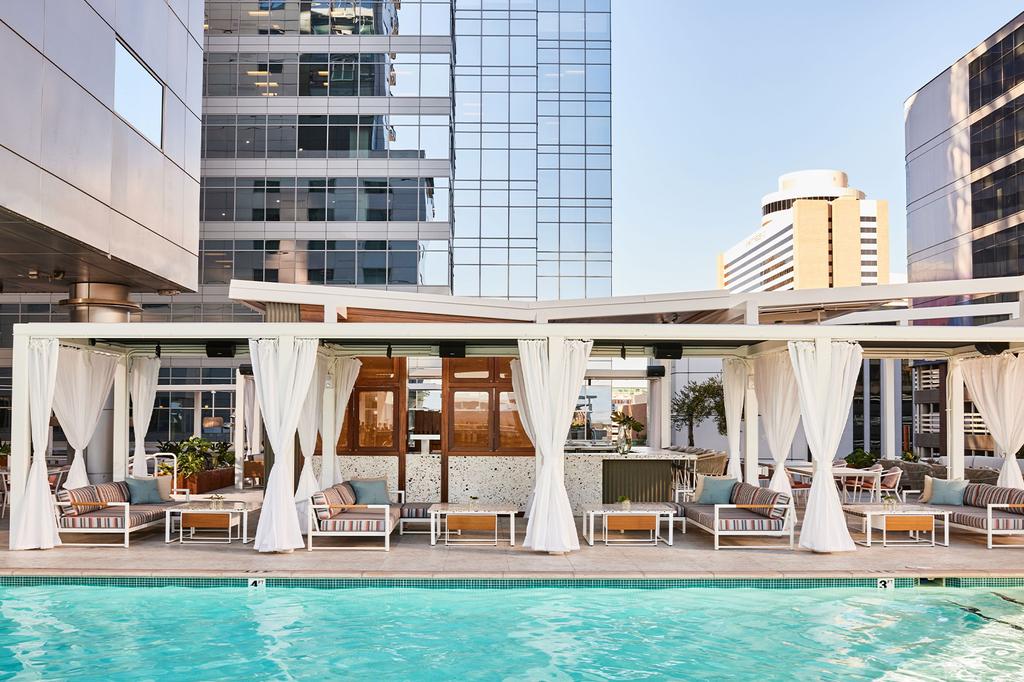 Rooftop pool area at a downtown Phoenix hotel with cabanas.