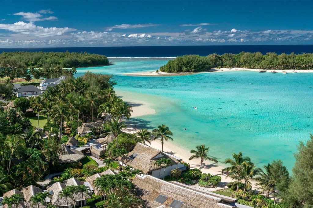 Aerial view of Rarotonga suites on Muri Beach with turquoise waters. 